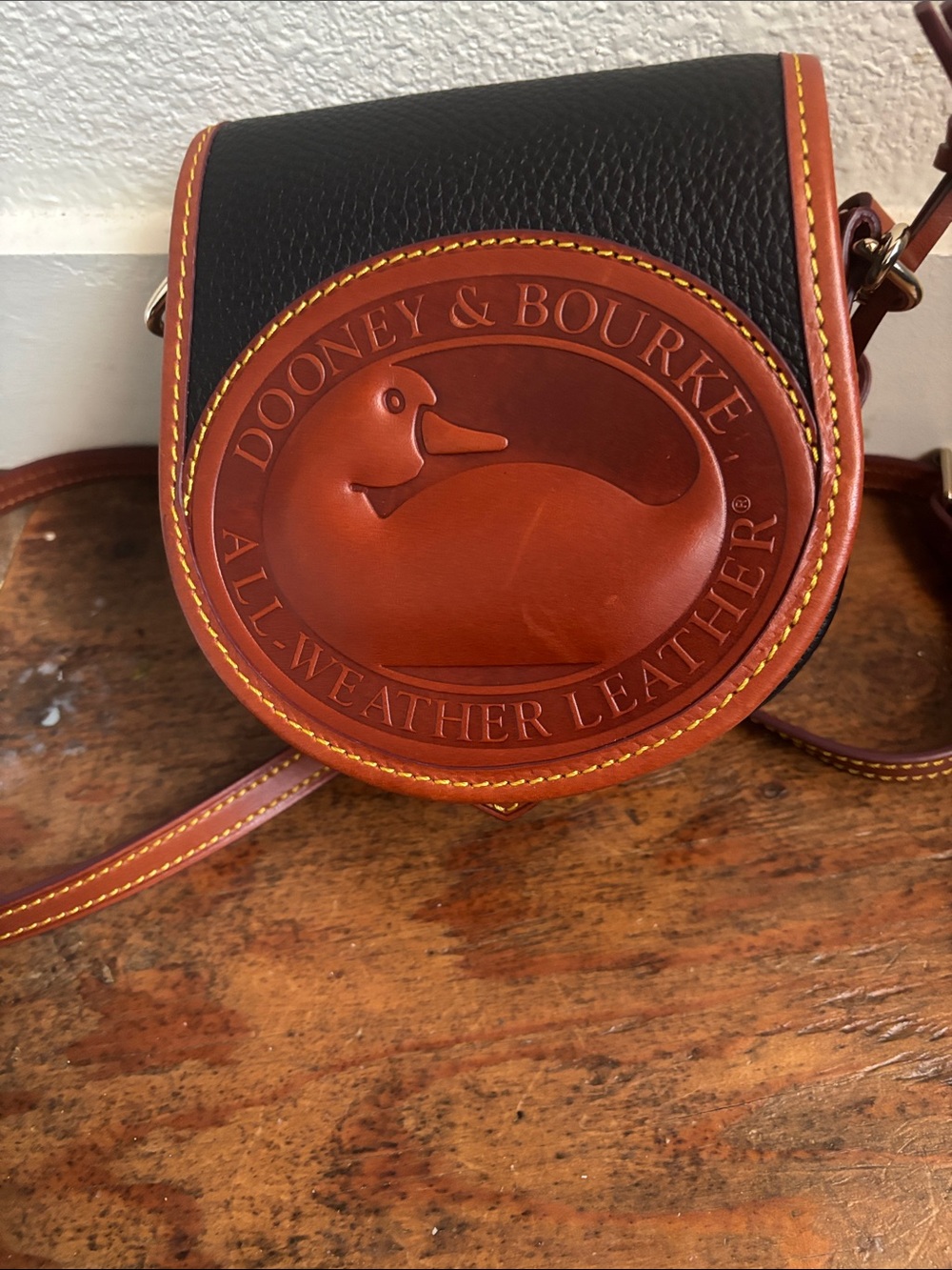 Dooney & Bourke Black and Tan Leather Saddle Crossbody